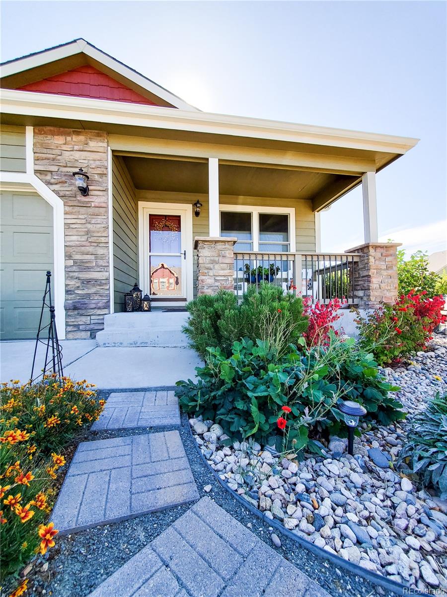 2151 Redhead Drive Johnstown, CO 80534 - Photo 3 of 37 a front view of a house with a porch