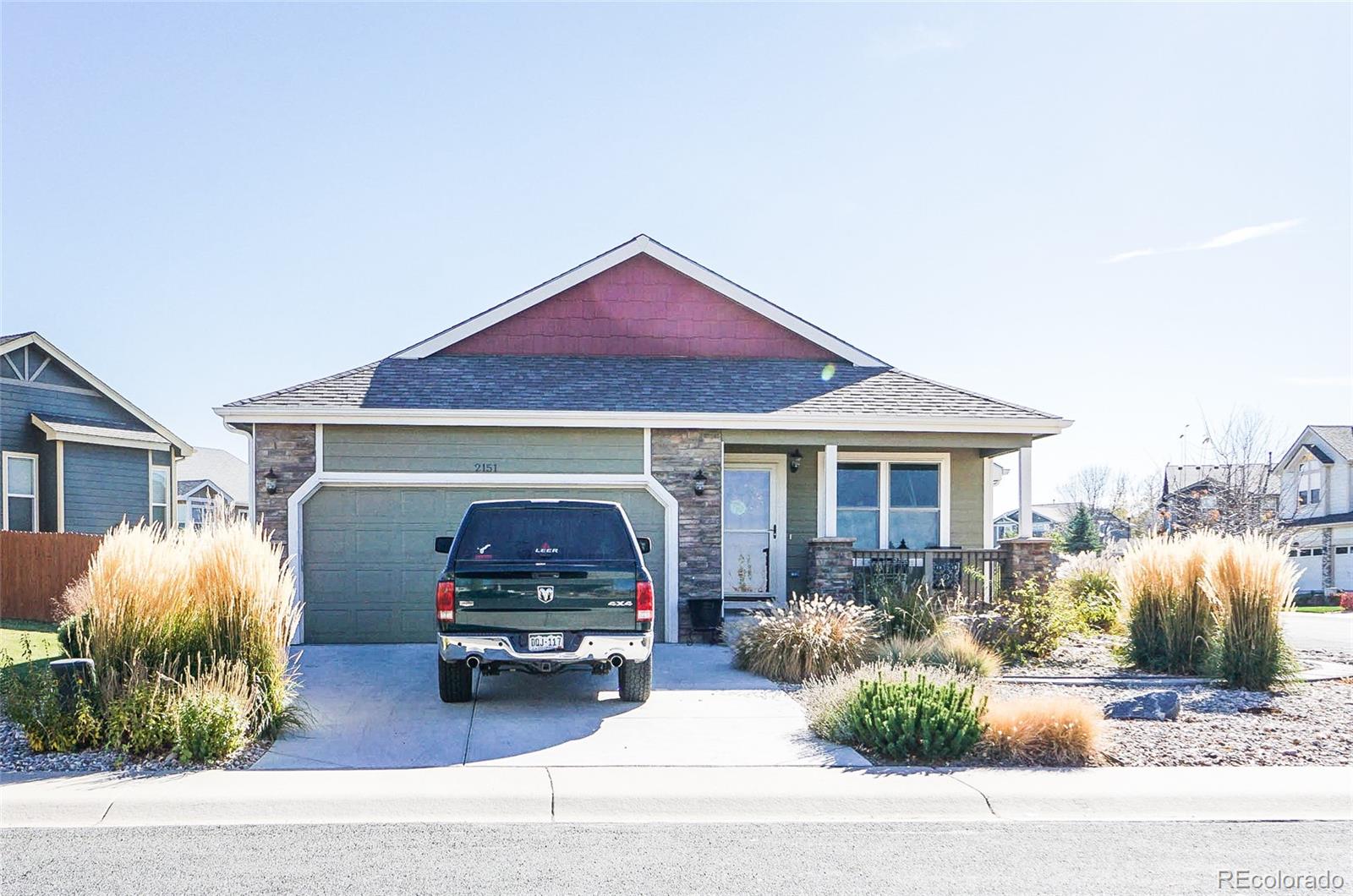 2151 Redhead Drive Johnstown, CO 80534 - Photo 6 of 37 a front view of a house with garden