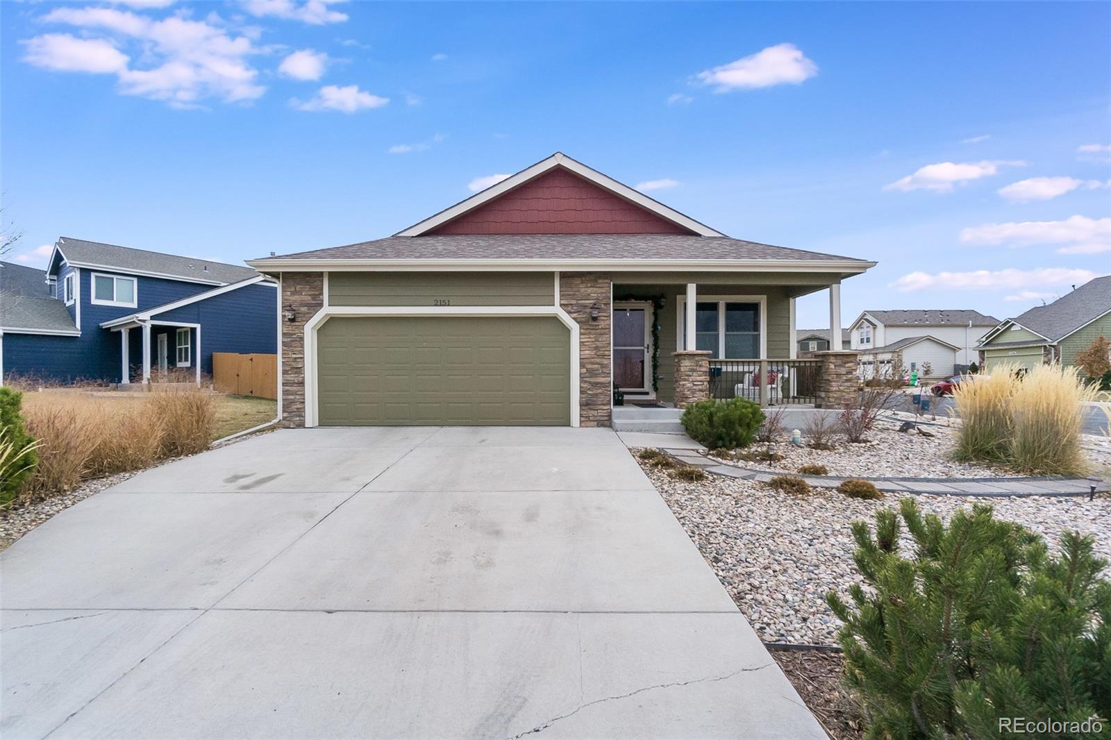 2151 Redhead Drive Johnstown, CO 80534 - Photo 10 of 37 a front view of a house with a yard and garage
