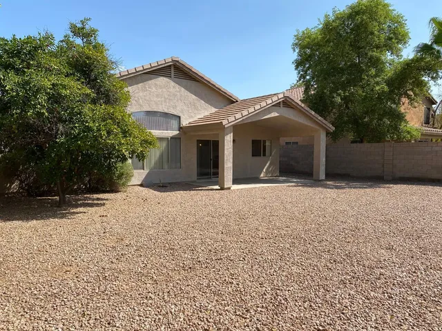 a view of kitchen and refrigerator in a room