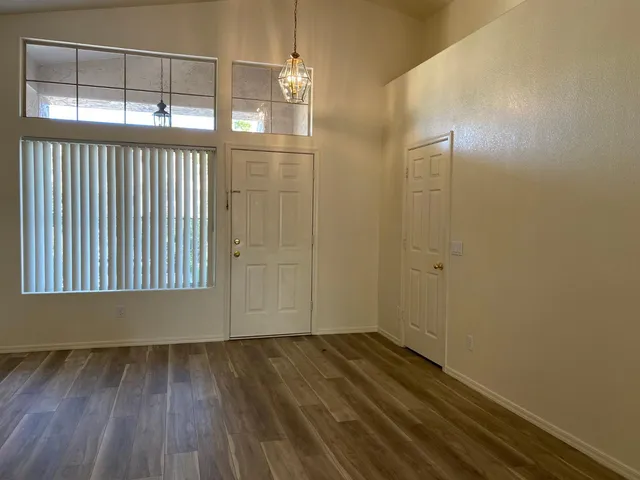 a bathroom with a double vanity sink a mirror and a bathtub