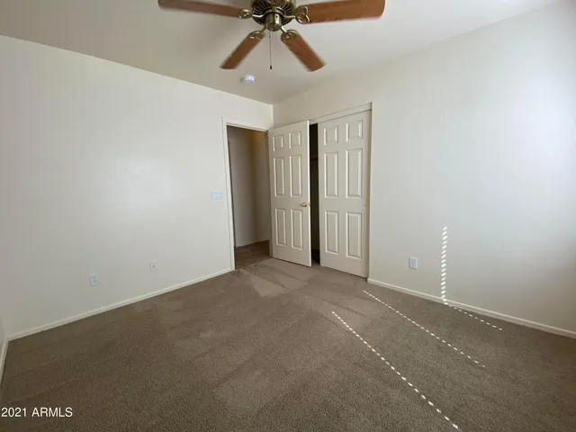 a bathroom with a double vanity sink a mirror and a bathtub