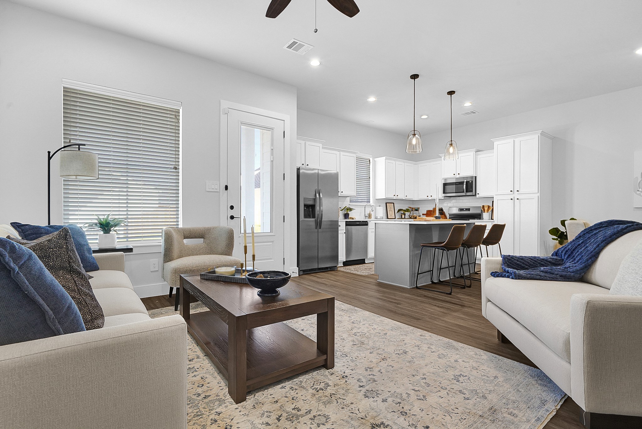 38634 Spur 149 Road, Unit 39B Magnolia, TX 77354 - Photo 5 of 50 WELCOME TO THE THREE BEDROOM! SOARING 10 FOOT CEILINGS, WOOD LAMINITE FLOORING (TWO OPTIONS- GREY OR BROWN), STAINLESS STEAL APPLIANCES AND SO MUCH MORE!