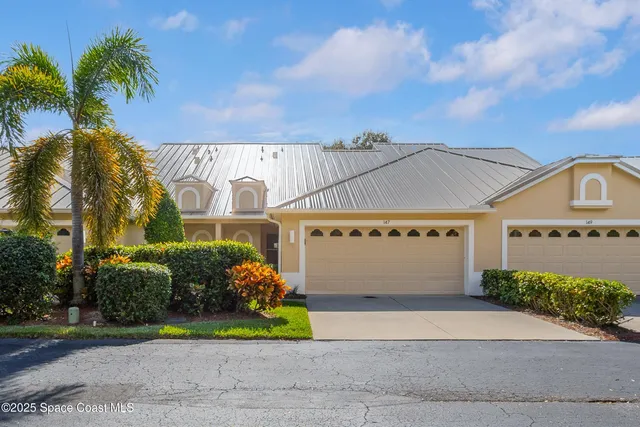 a balcony with table and chairs