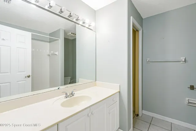 a room that has a bed and a chair in it