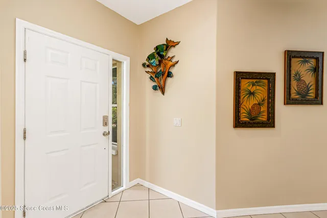 a view of a room with window and grass