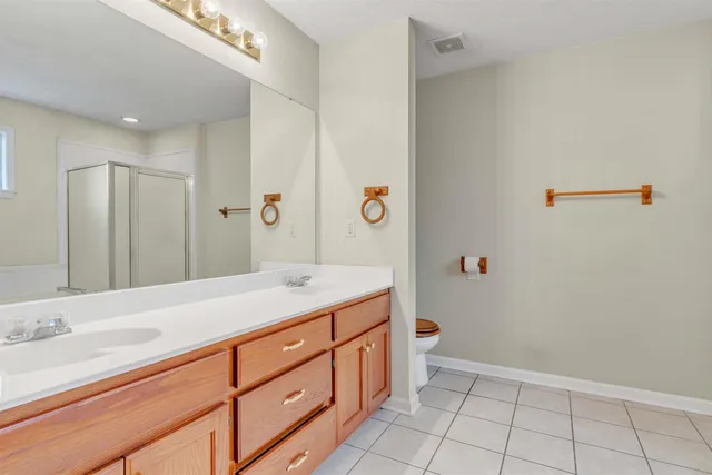 a bathroom with a sink a vanity and a mirror