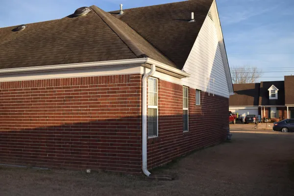 a view of a street with a building in the background
