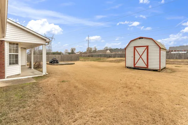 a view of a room next to a yard