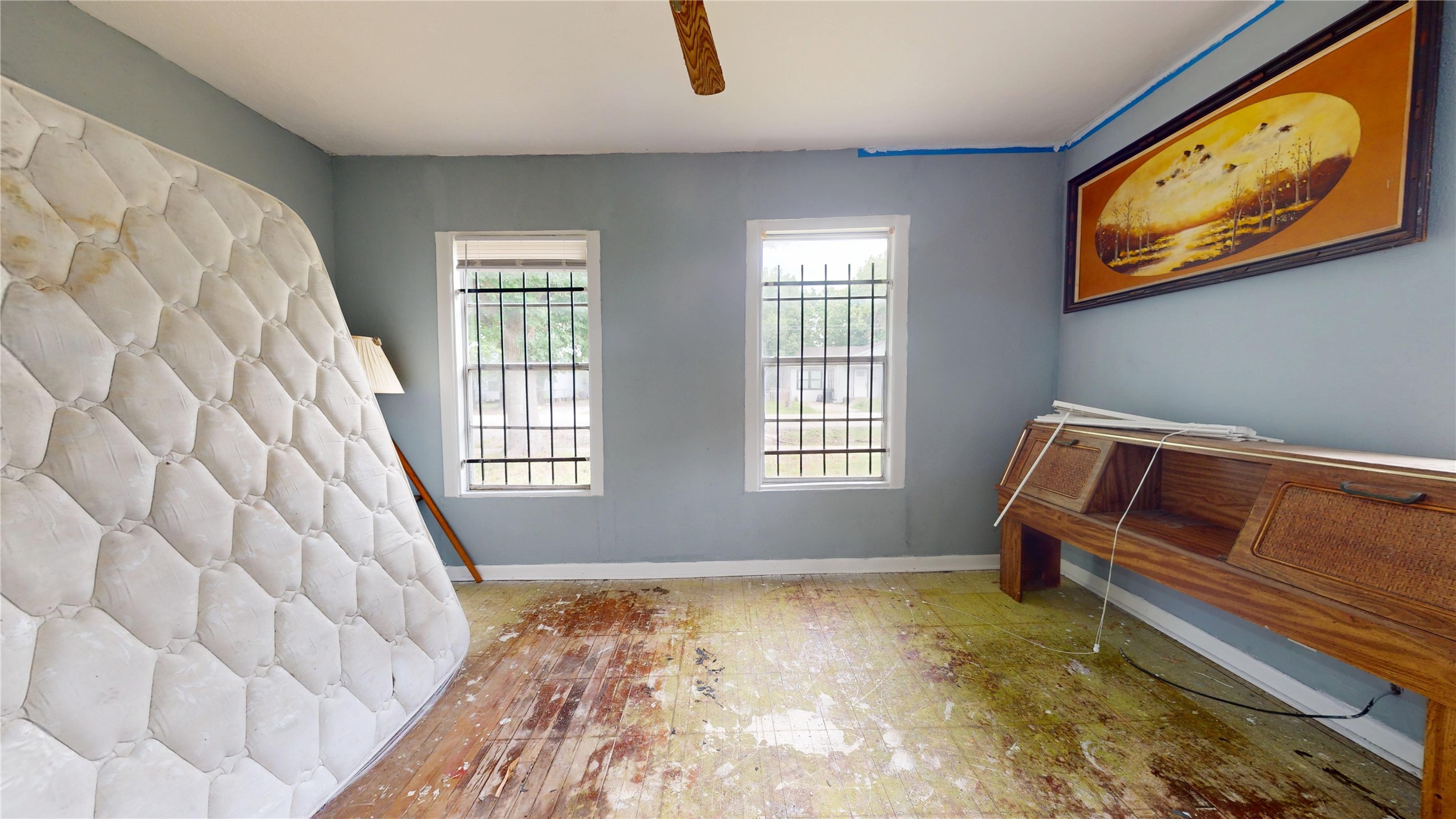 6604 Conley Street Houston, TX 77021 - Photo 16 of 28 a bedroom with a bed and wooden floor