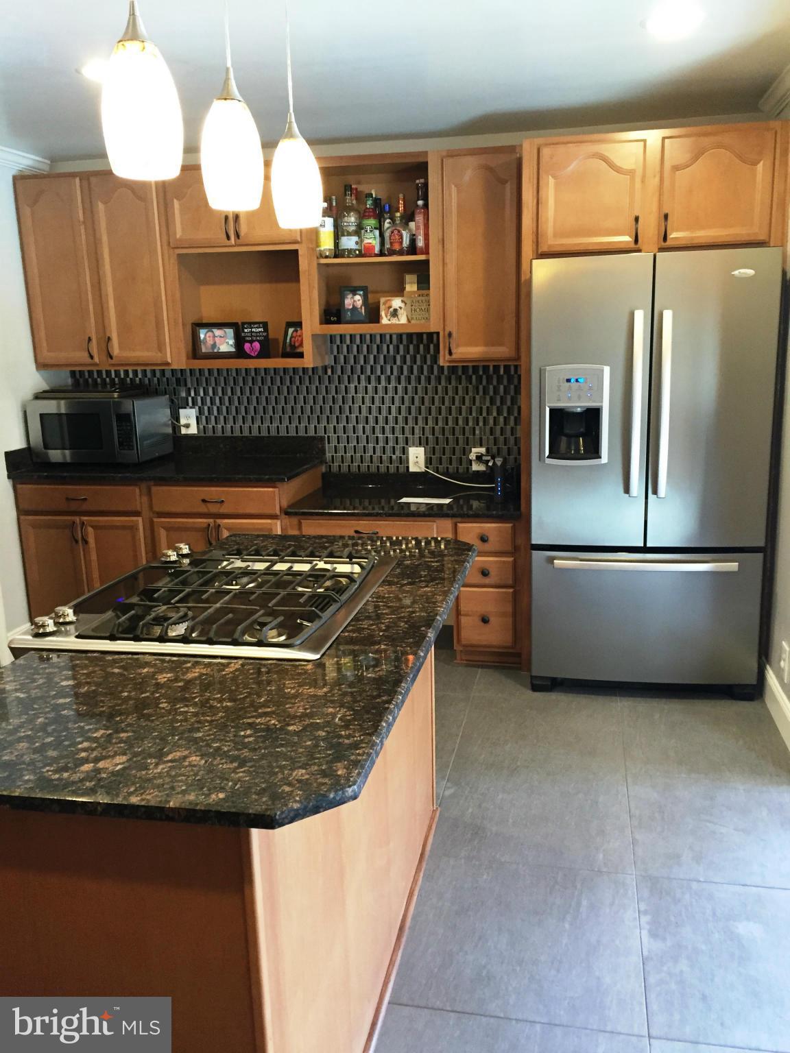 Custom back splash and newly installed tile floor
