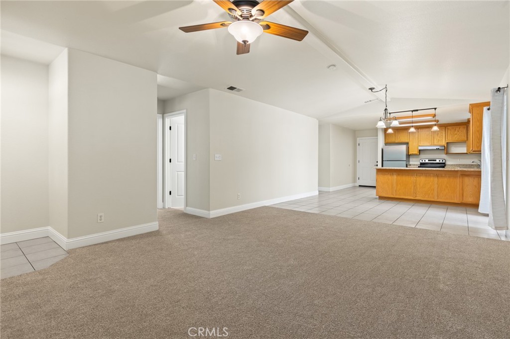 38 Kobe Loop Chico, CA 95973 - Photo 5 of 38 a view of a livingroom with a ceiling fan a kitchen view and a window