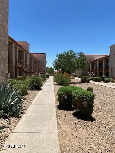 1440 North Idaho Road, Unit 2101 Apache Junction, AZ 85119 - Photo 21 of 23 1440 N Idaho #2101 Walkway to Stairs