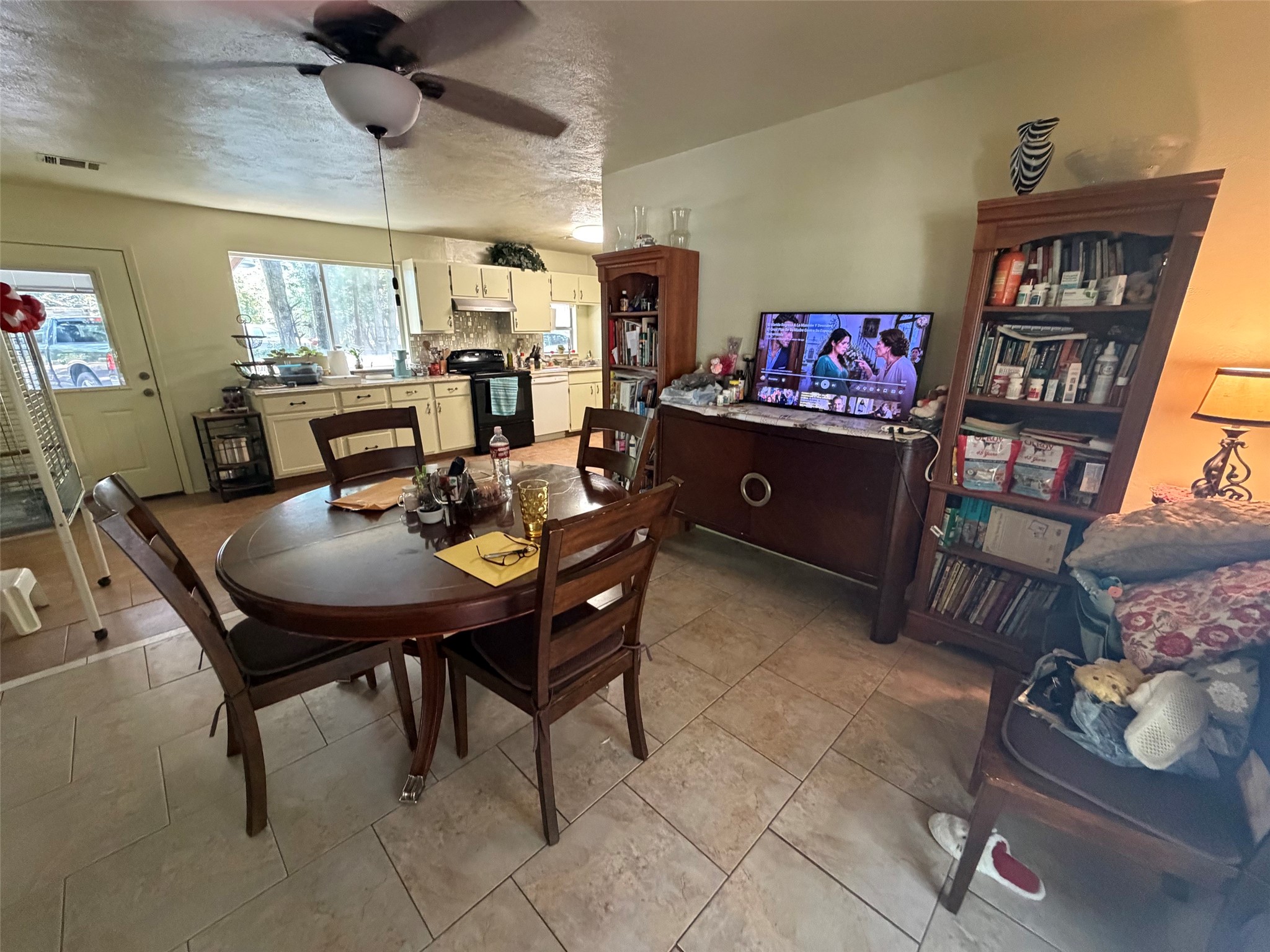 3080 Lee Turner Road Cleveland, TX 77328 - Photo 13 of 48 From casual breakfasts to holiday dinners, this welcoming dining space keeps the kitchen close at hand and provides plenty of room to gather with family and friends.