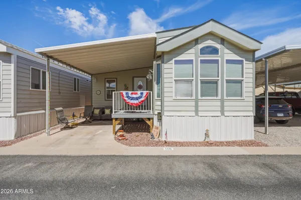 a view of a house with a patio and a garage