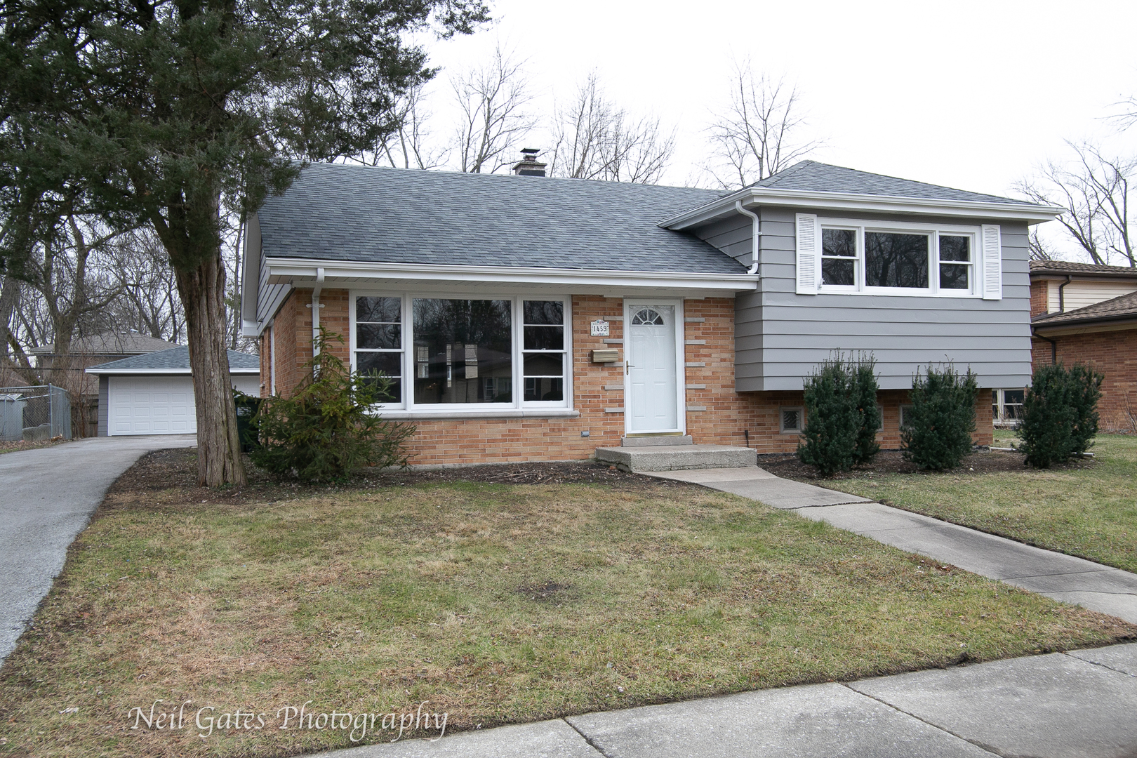 front view of a house with a yard