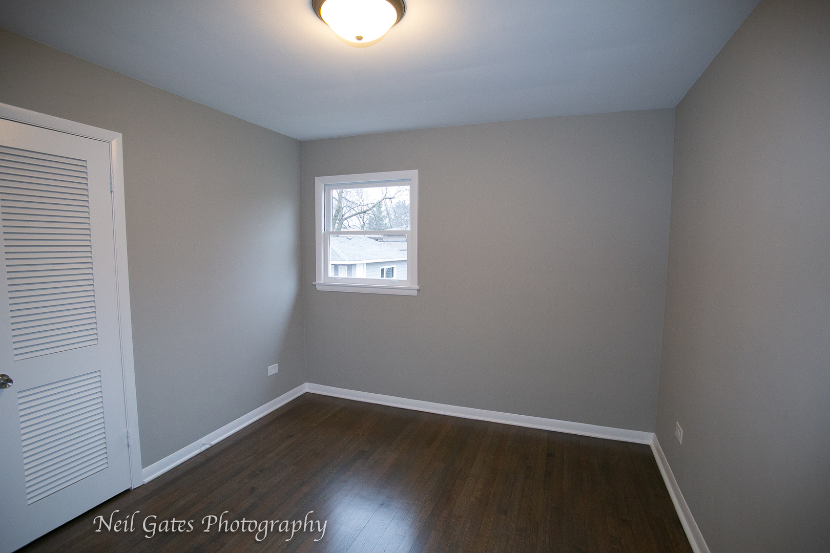 1459 West 187th Street Homewood, IL 60430 - Photo 12 of 32 an empty room with wooden floor and windows