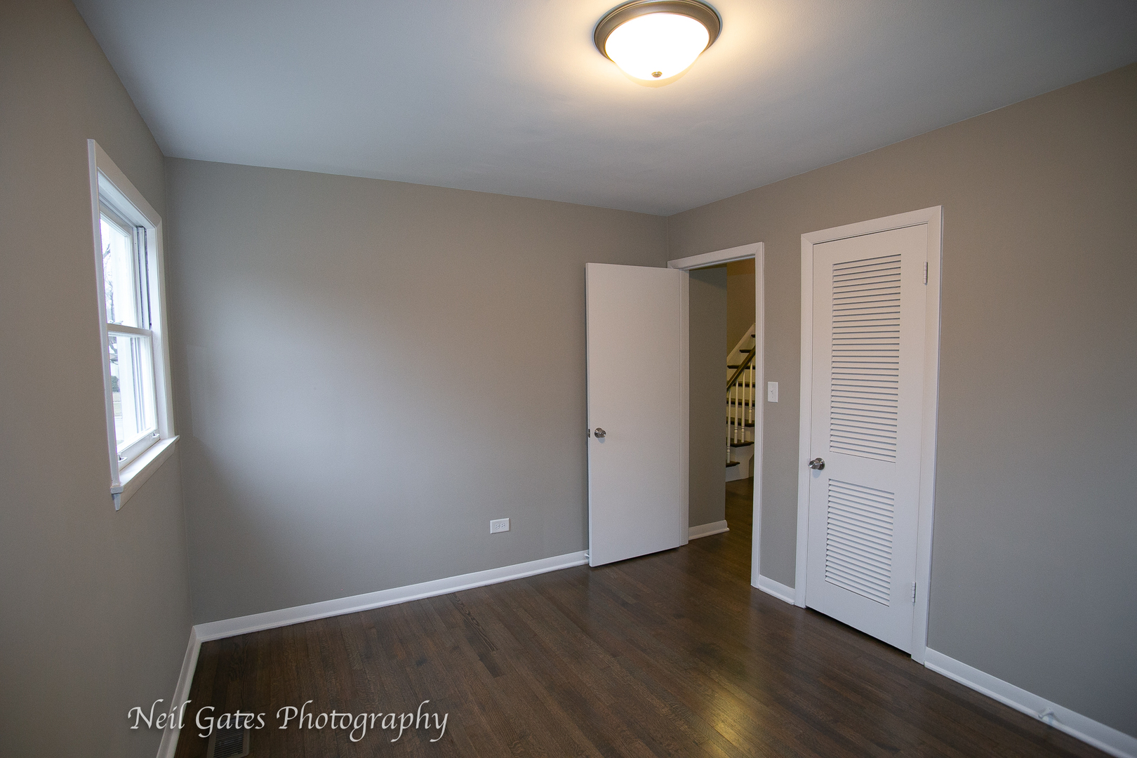 1459 West 187th Street Homewood, IL 60430 - Photo 13 of 32 an empty room with wooden floor and windows