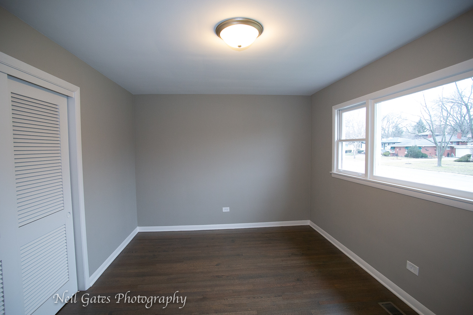 1459 West 187th Street Homewood, IL 60430 - Photo 16 of 32 an empty room with wooden floor and windows