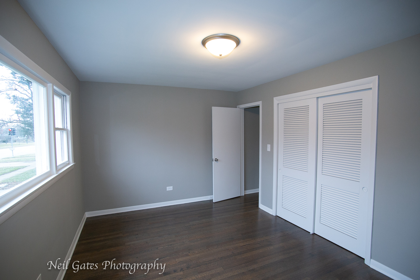 1459 West 187th Street Homewood, IL 60430 - Photo 17 of 32 an empty room with wooden floor and windows