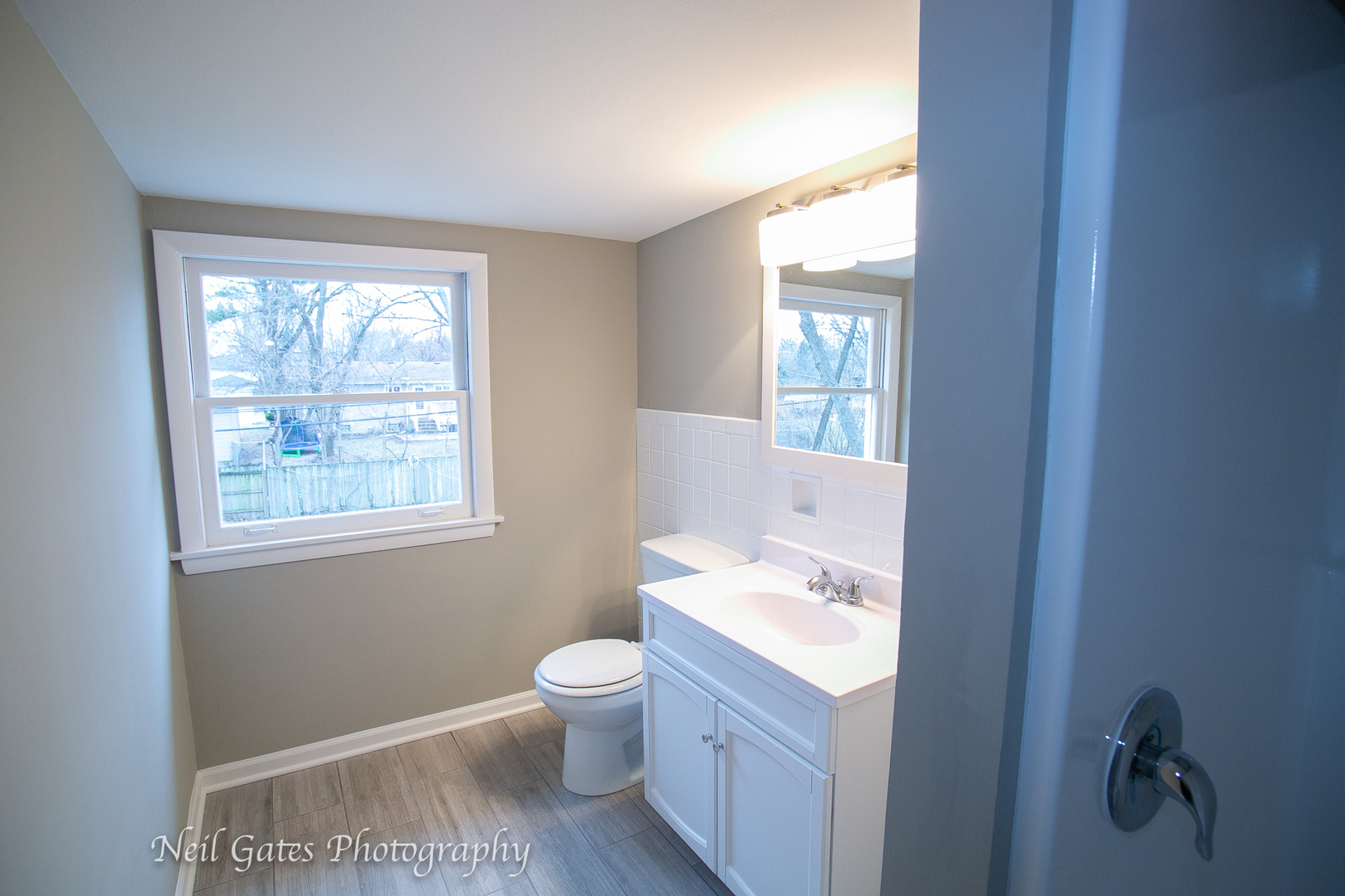 1459 West 187th Street Homewood, IL 60430 - Photo 20 of 32 a bathroom with a granite countertop sink toilet and mirror