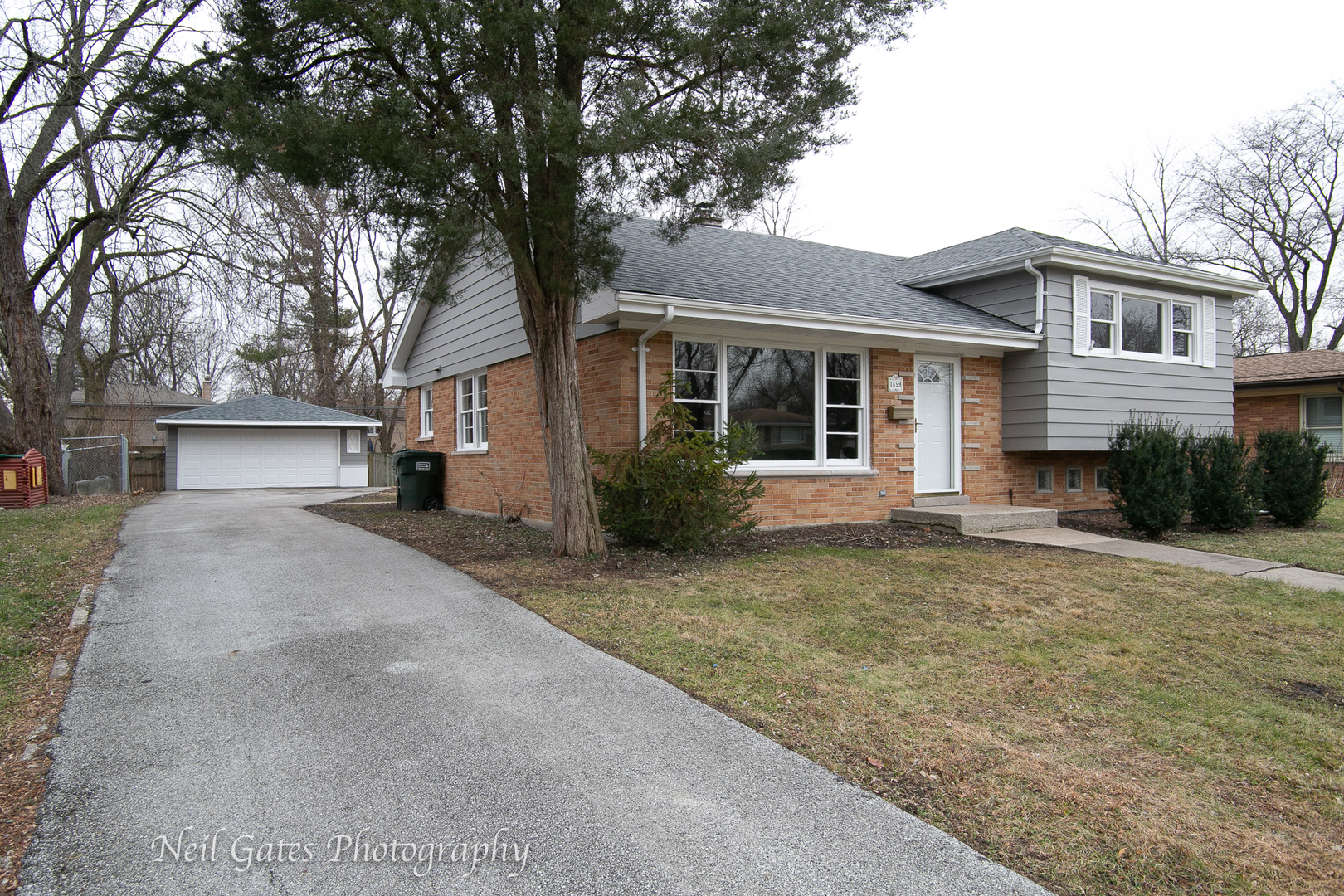 1459 West 187th Street Homewood, IL 60430 - Photo 32 of 32 a front view of a house with a yard and garage