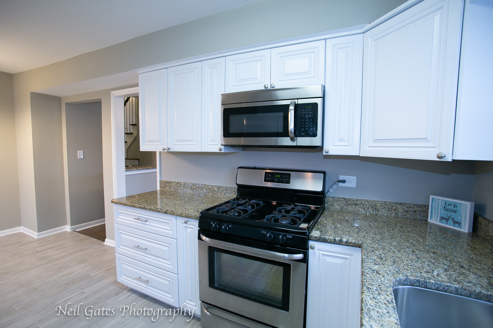 1459 West 187th Street Homewood, IL 60430 - Photo 7 of 32 a kitchen with granite countertop cabinets stainless steel appliances and a counter space
