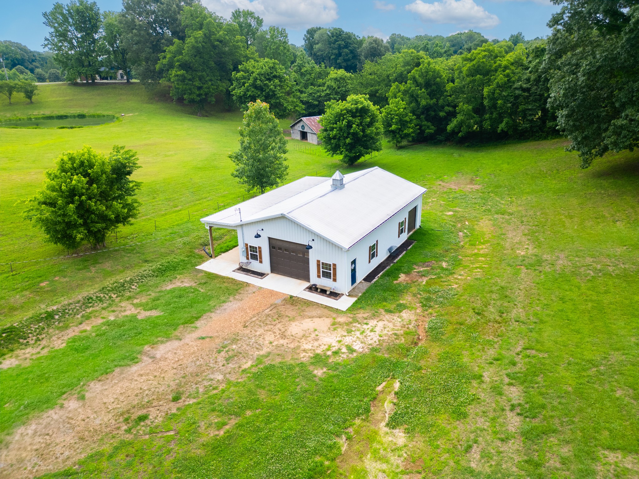 1015 Kelly Road Dyersburg, TN 38024 - Photo 33 of 41 a view of a house with a yard