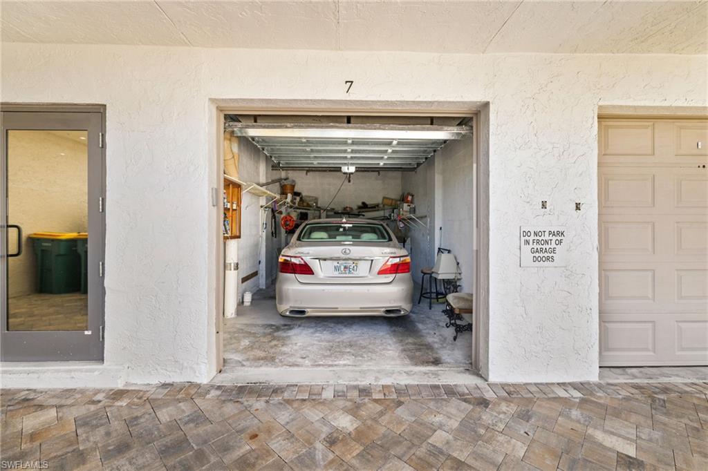 11 Bluebill Avenue, Unit 702 Naples, FL 34108 - Photo 23 of 35 a utility room with closet dryer and washer