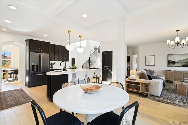 a large kitchen with a table and chairs