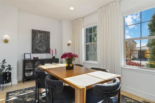 a dining room with a table and chairs