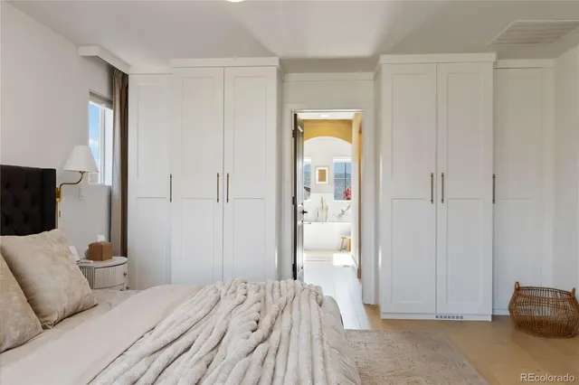 a bedroom with a bed and a couch