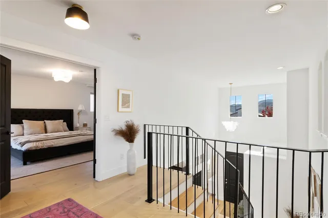 a view of a livingroom with furniture and stairs