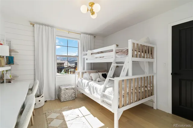 a bed room with a bed and a window