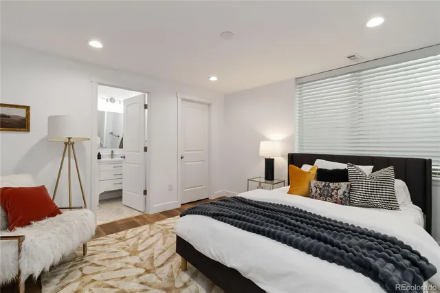 a bedroom with a bed and a couch