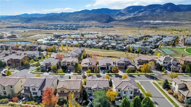 an aerial view of residential building and lake