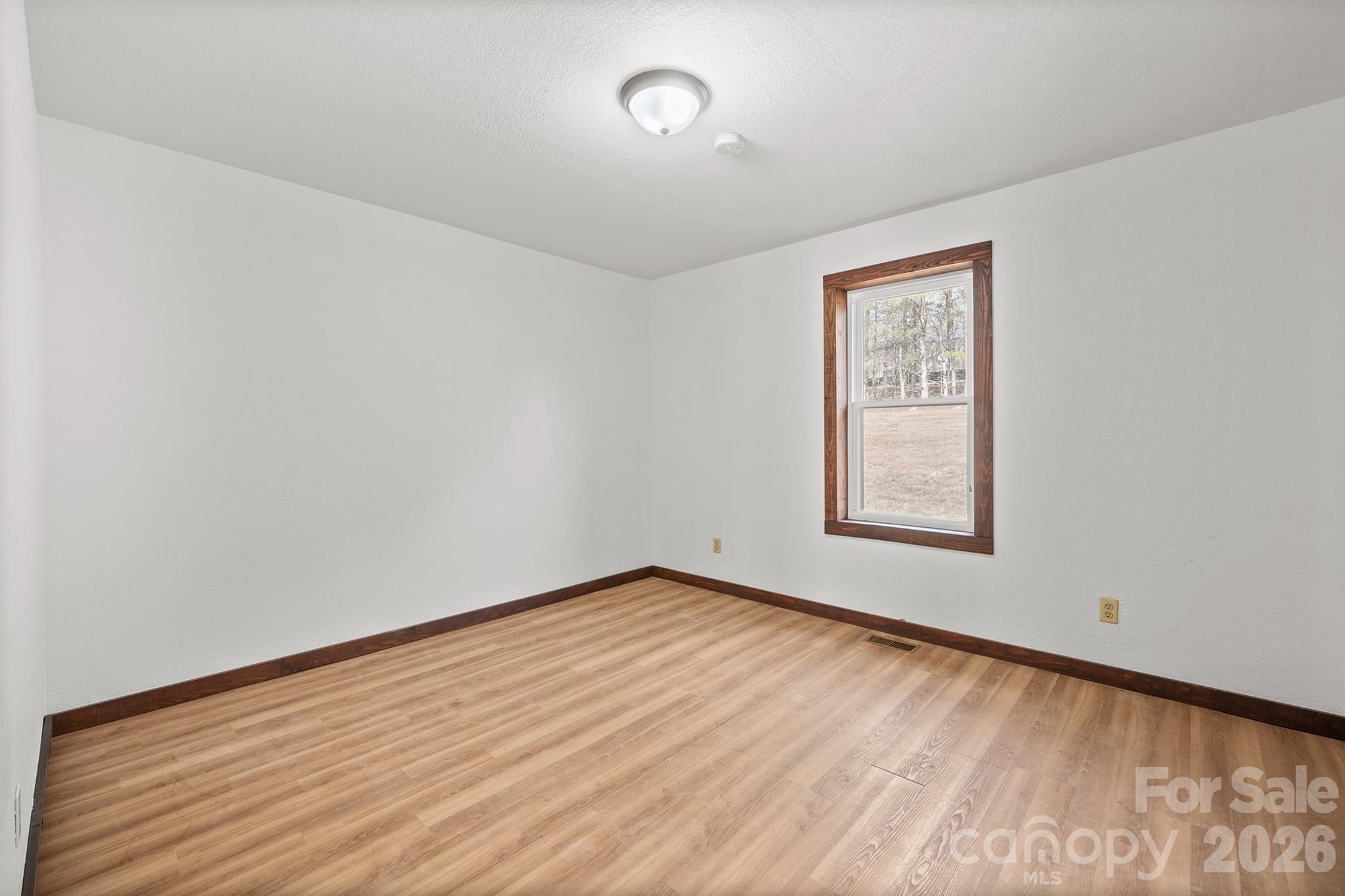 7400 Corn Hill Road Connelly Springs, NC 28612 - Photo 24 of 41 an empty room with a window