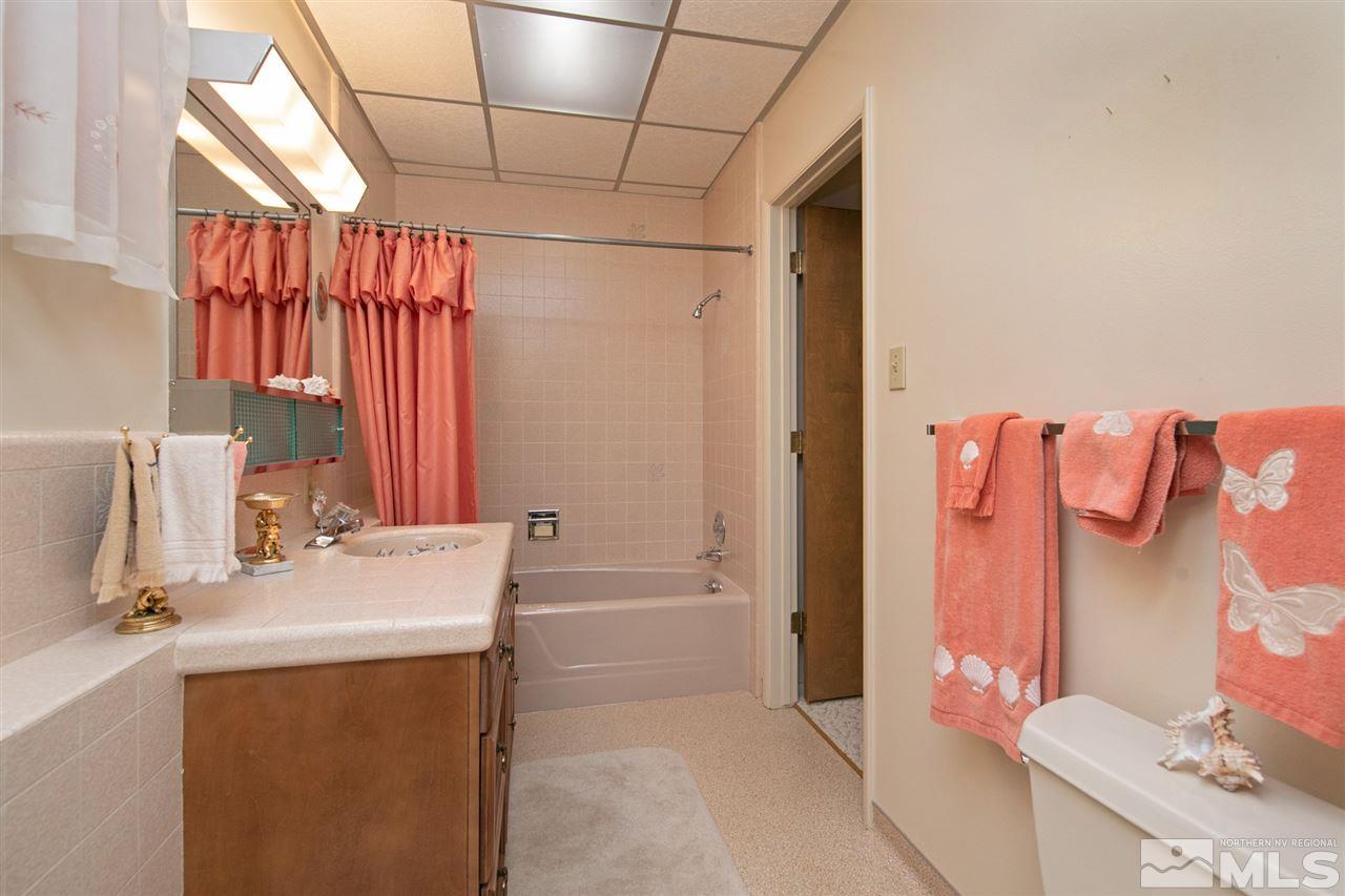 3360 Marthiam Avenue Reno, NV 89509 - Photo 13 of 39 a bathroom with a sink toilet and shower