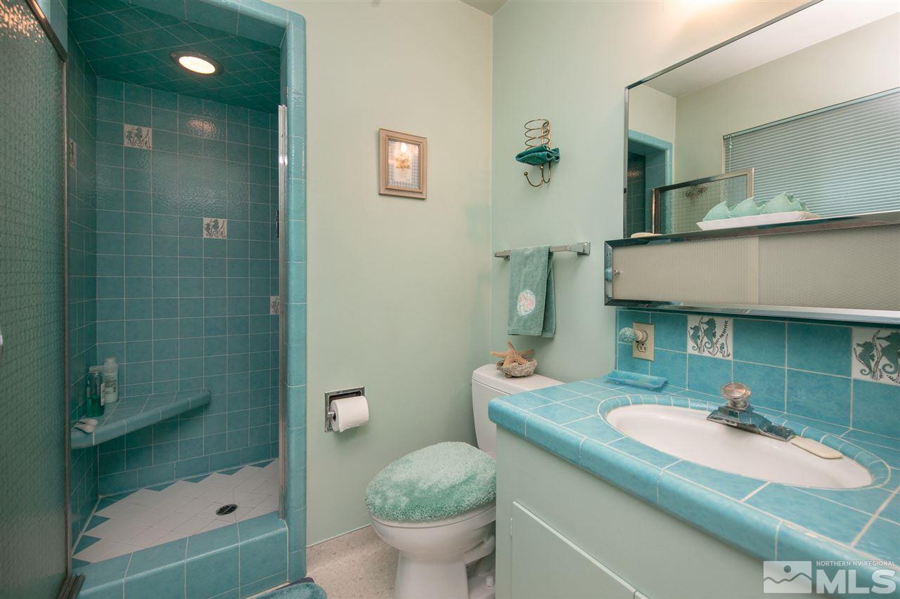 3360 Marthiam Avenue Reno, NV 89509 - Photo 19 of 39 a bathroom with a sink toilet and shower