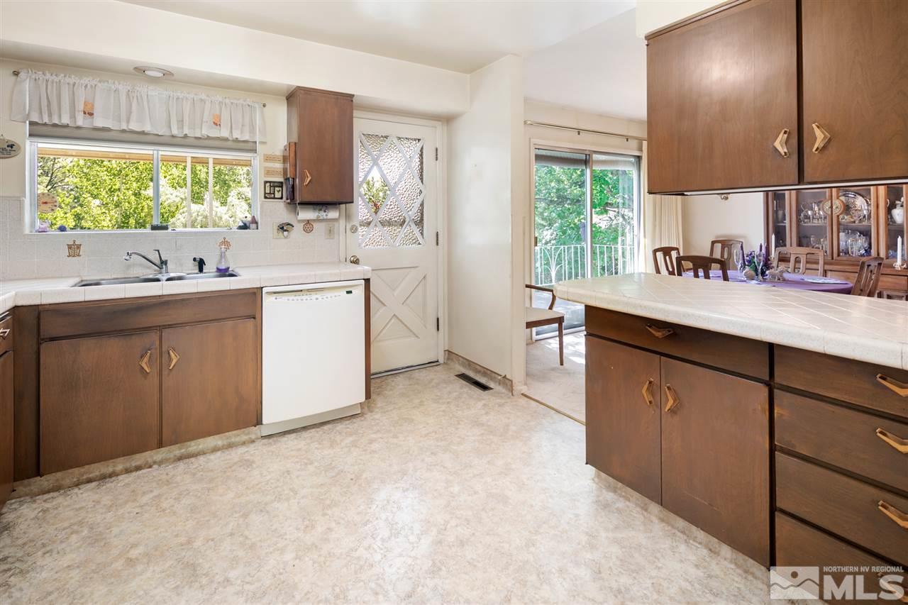 3360 Marthiam Avenue Reno, NV 89509 - Photo 2 of 39 a kitchen with sink cabinets and window