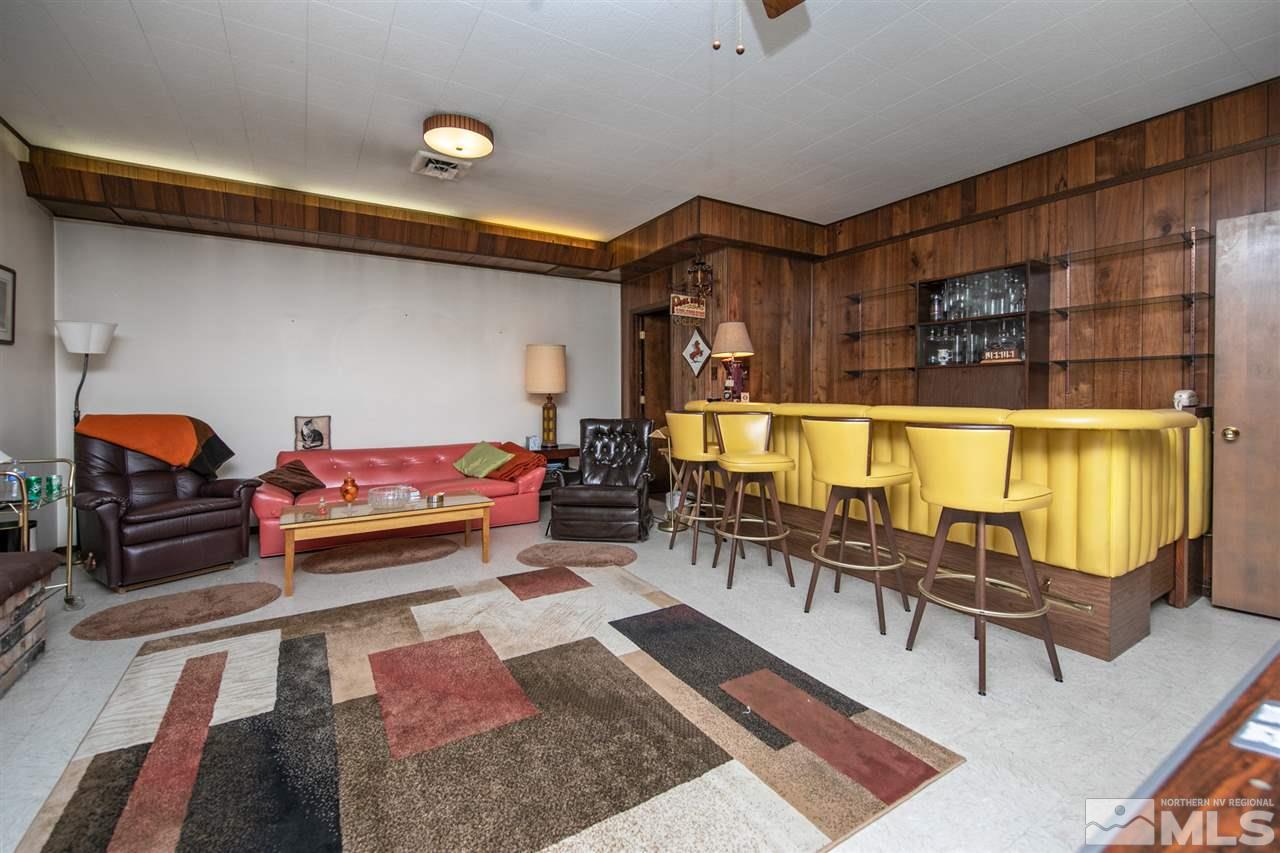3360 Marthiam Avenue Reno, NV 89509 - Photo 25 of 39 a living room with furniture and a rug