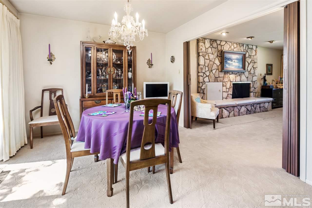 3360 Marthiam Avenue Reno, NV 89509 - Photo 5 of 39 a view of a dining room with furniture and chandelier