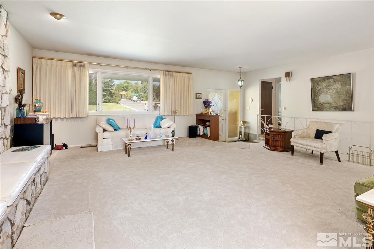 3360 Marthiam Avenue Reno, NV 89509 - Photo 6 of 39 a living room with furniture and large windows