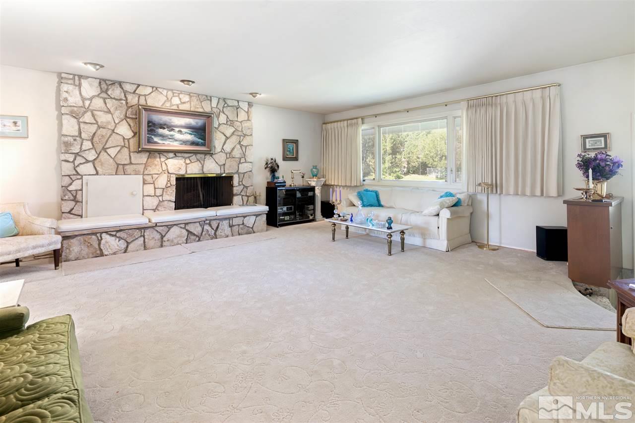 3360 Marthiam Avenue Reno, NV 89509 - Photo 7 of 39 a living room with furniture and fireplace