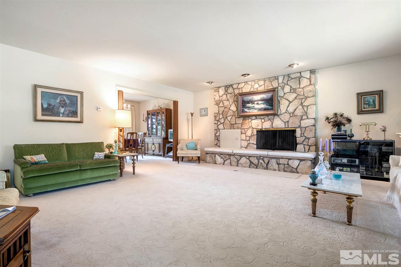3360 Marthiam Avenue Reno, NV 89509 - Photo 9 of 39 a living room with furniture and a flat screen tv