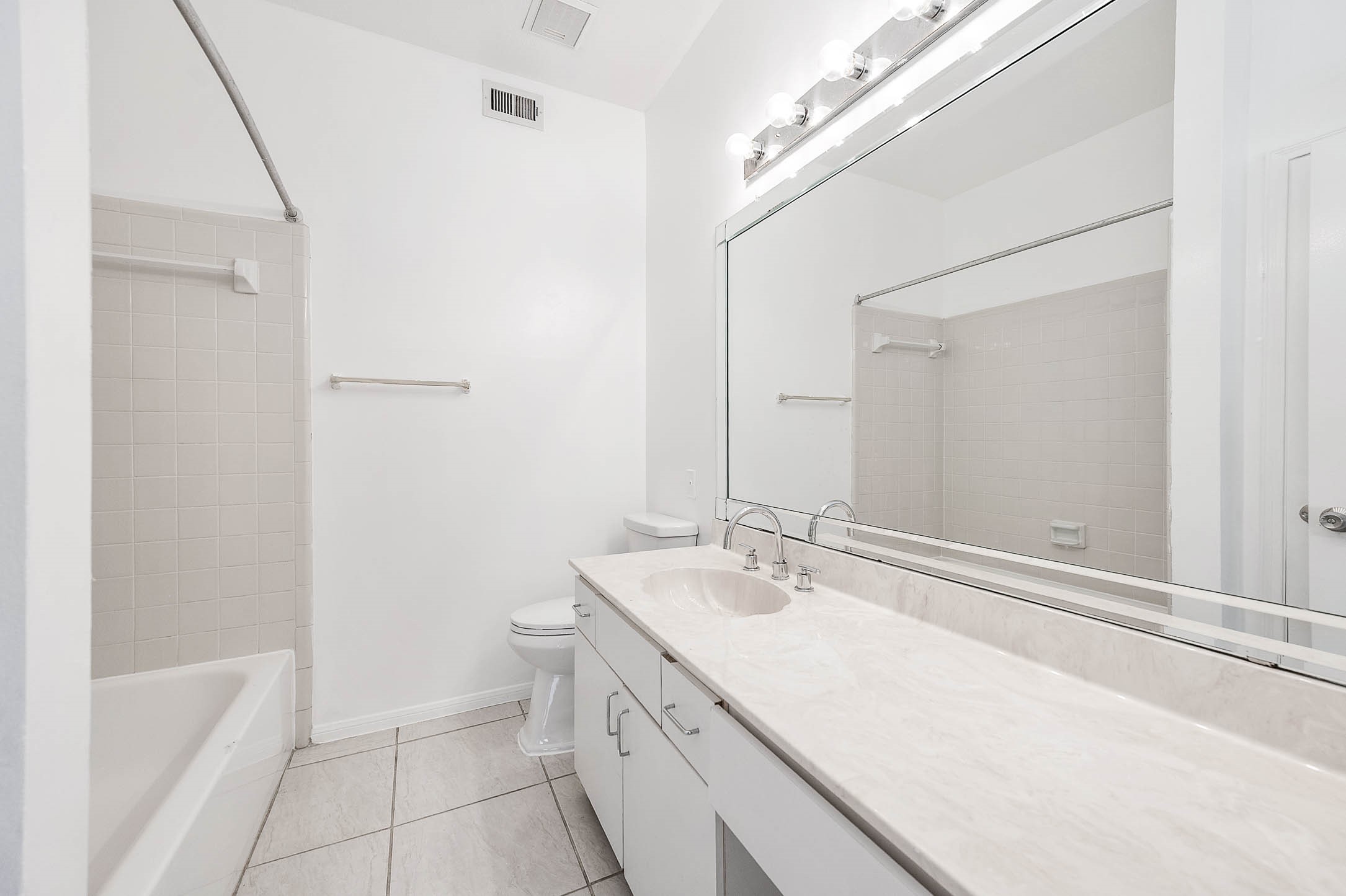 6000 Reims Road, Unit 2003 Houston, TX 77036 - Photo 20 of 24 a bathroom with a sink a toilet and shower