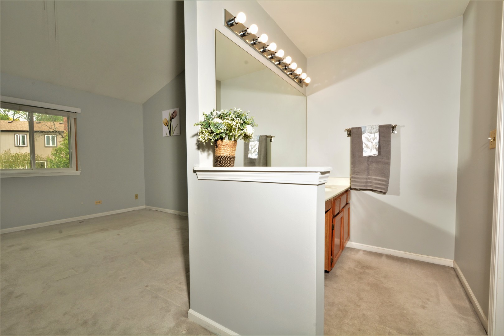 8187 Ripple Ridge Darien, IL 60561 - Photo 11 of 21 a view of hallway with furniture and a chandelier