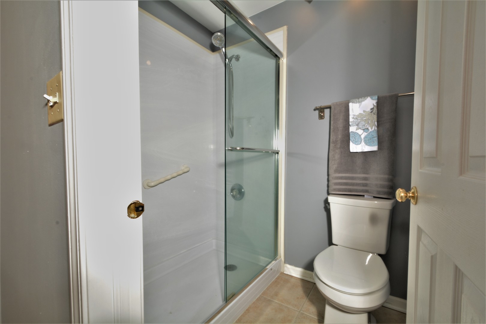8187 Ripple Ridge Darien, IL 60561 - Photo 14 of 21 a white toilet sitting next to a shower