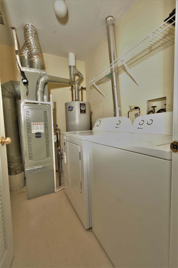 8187 Ripple Ridge Darien, IL 60561 - Photo 16 of 21 a utility room with dryer and washer