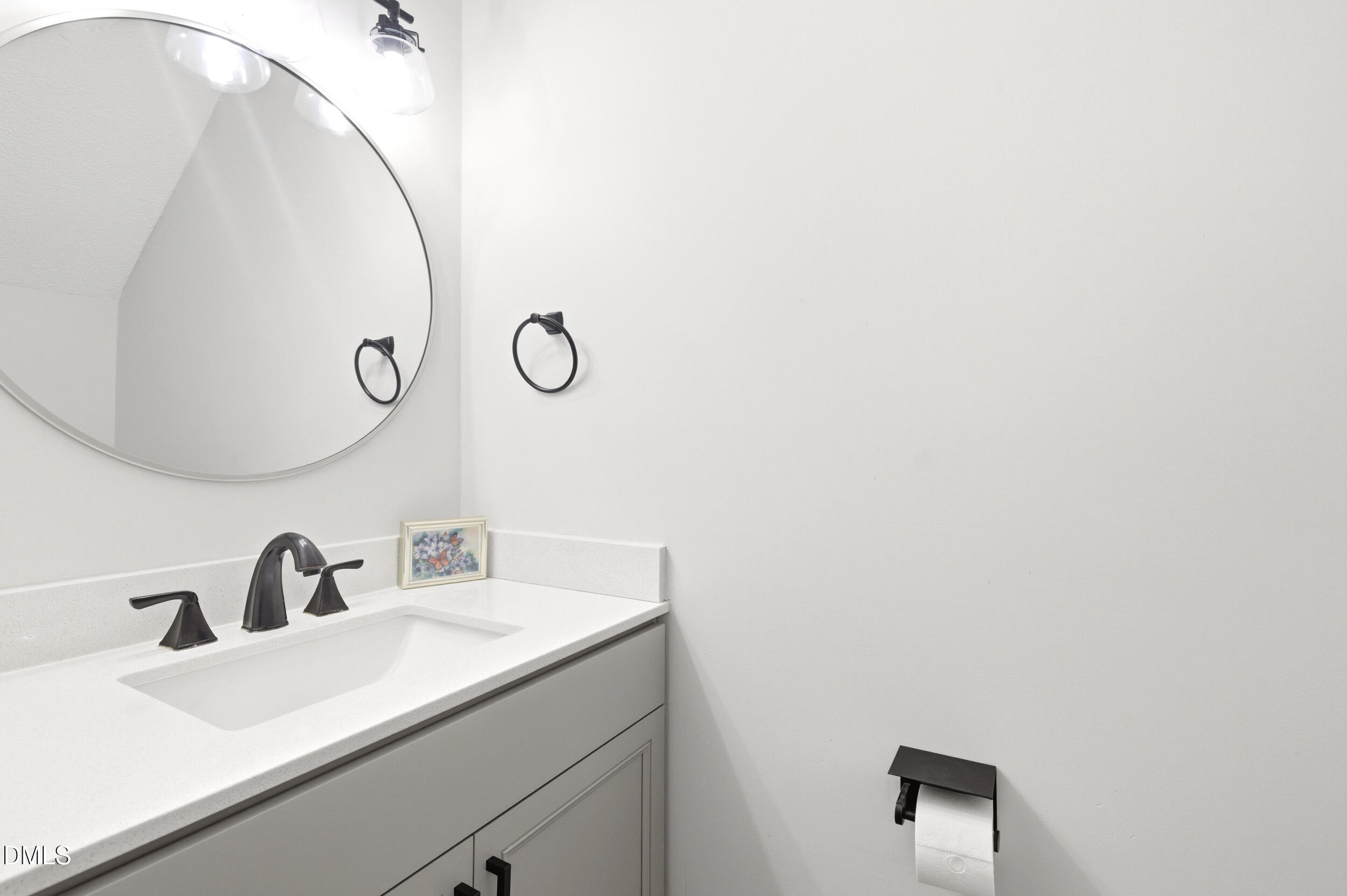 725 Charleston Road Raleigh, NC 27606 - Photo 11 of 27 a bathroom with a sink and mirror